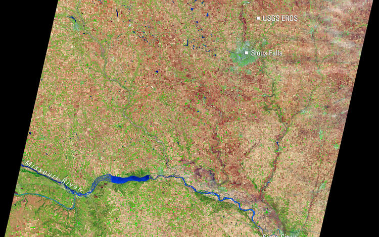 Satellite image of eastern South Dakota showing Sioux Falls, the USGS EROS Center, Sioux City, and the Missouri River.