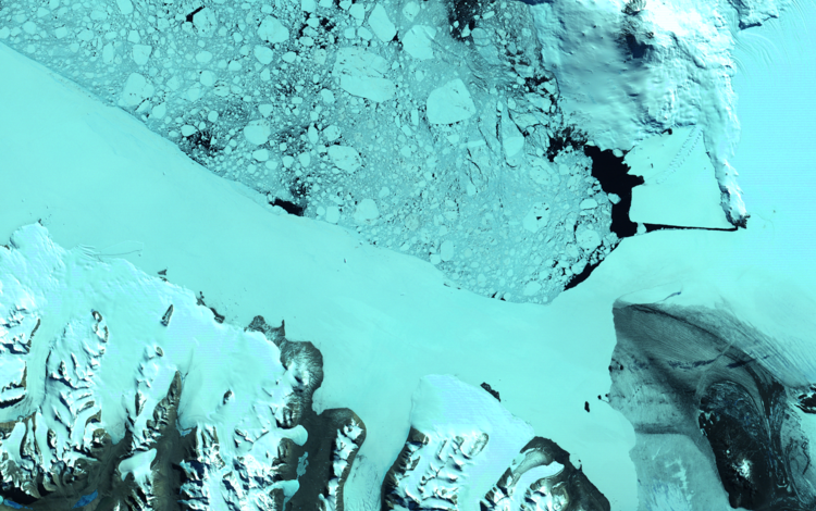Satellite image showing birds eyes views of ice, snow and water in shades of blues and black