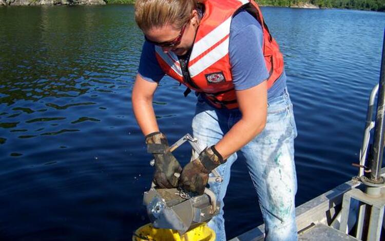 Graduate student working on a lake sturgeon project