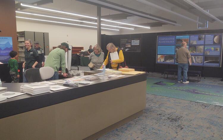 Visitors attend the USGS Open House in the Astrogeology Science Center, Nov 2023