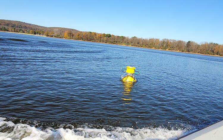 Yellow sampling Buoy floating in the reservoir 