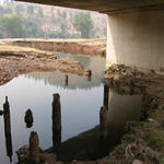 Bridge abutments scoured by the Battle Creek flood