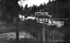 Flood waters flow over a bridge in Hot Springs 1927