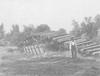 Lawrence, KS 1903 Flood. Train tracks and train car flipped over 