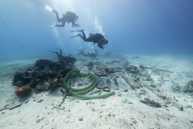 National Park Services (NPS) archaeologists survey the wreck of the HMS Fowey