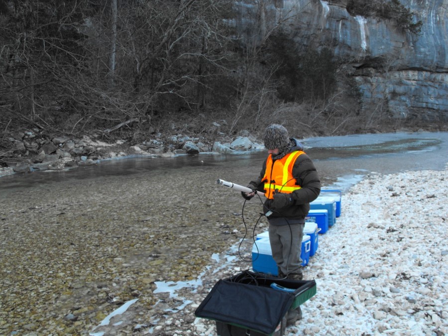 USGS Scientist collecting water samples in a stream